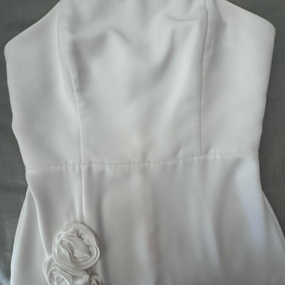 Strapless maxi dress with side slit and flower embellishment